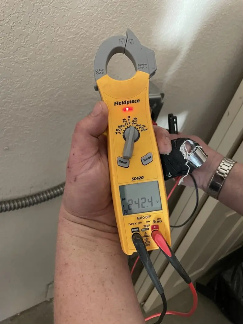 Voltage testing with clamp meter during Ceiling Fan Installation in Wichita Falls